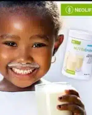 Smiling child holding a glass of milky shake beside a NeoLife NutriShake Vanilla tub and the NeoLife logo, a family protein drink.